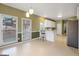 Bright dining room featuring a large window, bar seating and modern lighting at 9135 Woodhaven Way, Mcdonough, GA 30253