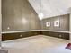 Open living area showcasing neutral colors, a high ceiling and a chandelier at 9135 Woodhaven Way, Mcdonough, GA 30253