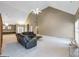Bright living room with vaulted ceiling, neutral carpet, fireplace and two sofas at 9135 Woodhaven Way, Mcdonough, GA 30253
