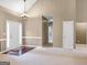 Inviting living room featuring neutral walls and carpet, with natural light streaming in at 9135 Woodhaven Way, Mcdonough, GA 30253