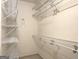 Spacious walk-in closet featuring wire shelving for optimized storage solutions at 9135 Woodhaven Way, Mcdonough, GA 30253