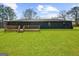 Large backyard with a well-maintained green lawn and deck at 2692 Fairview Rd, Covington, GA 30016