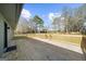 Expansive wooden deck with wood railing overlooks the backyard at 2692 Fairview Rd, Covington, GA 30016