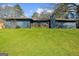 Charming single-story home with a brick chimney, well-maintained lawn, and inviting front porch at 2692 Fairview Rd, Covington, GA 30016
