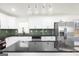 Bright kitchen with stainless appliances, island, and decorative backsplash at 2692 Fairview Rd, Covington, GA 30016