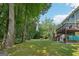 Large backyard featuring mature trees, a private wooded area, and an inviting deck at 230 Wyngate Cir, Fayetteville, GA 30215