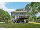 Expansive backyard with a well-maintained lawn, a charming garden, and a spacious deck perfect for outdoor relaxation at 230 Wyngate Cir, Fayetteville, GA 30215