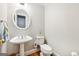 Bathroom with a pedestal sink and a white toilet at 230 Wyngate Cir, Fayetteville, GA 30215
