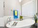 Charming bathroom with a clawfoot tub, window and great natural light at 230 Wyngate Cir, Fayetteville, GA 30215