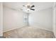 Clean, neutral bedroom with carpet, light gray walls, ceiling fan, and a window for natural light at 230 Wyngate Cir, Fayetteville, GA 30215