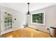 Cozy breakfast nook featuring hardwood floors, natural light, and access to an outdoor area at 230 Wyngate Cir, Fayetteville, GA 30215