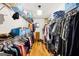 Spacious walk-in closet featuring ample storage with built in shelves and hanging rods at 230 Wyngate Cir, Fayetteville, GA 30215