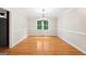 Dining room with decorative crown molding and bright hardwood flooring at 230 Wyngate Cir, Fayetteville, GA 30215