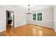 Bright and airy dining room with a classic chandelier, bright hardwood flooring at 230 Wyngate Cir, Fayetteville, GA 30215