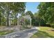 Lovely two-story home with long driveway and mature trees at 230 Wyngate Cir, Fayetteville, GA 30215