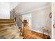 View of the foyer featuring a carpeted staircase with wood and black rod iron banister at 230 Wyngate Cir, Fayetteville, GA 30215