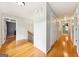 Bright hallway with gleaming hardwood floors and neutral wall colors, adjacent to bedrooms at 230 Wyngate Cir, Fayetteville, GA 30215