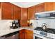 Kitchen with wooden cabinets, and stainless steel appliances at 230 Wyngate Cir, Fayetteville, GA 30215