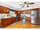 Well-equipped kitchen featuring stainless steel appliances and wood cabinetry at 230 Wyngate Cir, Fayetteville, GA 30215