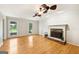 Spacious living room featuring hardwood floors, stone fireplace, and lots of natural light at 230 Wyngate Cir, Fayetteville, GA 30215