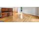 Bright living room featuring bright hardwood floors, piano, and natural light at 230 Wyngate Cir, Fayetteville, GA 30215