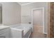 Bathroom featuring a jacuzzi tub and a doorway to another room at 3973 Laurel Bend Dr, Snellville, GA 30039