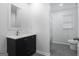 The bathroom is bright, featuring tile floor, a sink vanity, toilet, and a tub shower at 3973 Laurel Bend Dr, Snellville, GA 30039