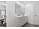 Bathroom with a double vanity and an expansive mirror at 3973 Laurel Bend Dr, Snellville, GA 30039