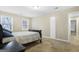 The bedroom is spacious, has two windows that provide plenty of natural light, and is comfortably carpeted at 3973 Laurel Bend Dr, Snellville, GA 30039