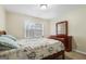 The bedroom is well-lit and features neutral walls, and a window for natural light at 3973 Laurel Bend Dr, Snellville, GA 30039