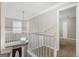 The hallway is bathed in light and provides entry to additional rooms with a captivating view of the home's entryway at 3973 Laurel Bend Dr, Snellville, GA 30039