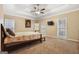 Main bedroom featuring a tray ceiling, neutral walls, carpet, and natural light at 3973 Laurel Bend Dr, Snellville, GA 30039