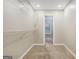 A walk-in closet with abundant shelving to meet all storage needs at 3973 Laurel Bend Dr, Snellville, GA 30039