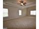 Large primary bedroom with carpet, trey ceiling, and natural light at 175 Osier Dr, Mcdonough, GA 30252
