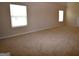 Large bonus room with plush carpeting and natural light from multiple windows at 175 Osier Dr, Mcdonough, GA 30252