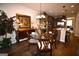Cozy dining area featuring a glass table, chandelier, and seamless flow into the modern kitchen at 175 Osier Dr, Mcdonough, GA 30252