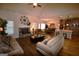 Open living space with fireplace, hardwood floors, and views of the dining area and modern kitchen at 175 Osier Dr, Mcdonough, GA 30252