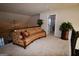 Open loft area featuring a comfortable sofa and doorway to another room at 175 Osier Dr, Mcdonough, GA 30252