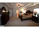 Main bedroom showing bed, dresser, carpet, and tray ceiling at 175 Osier Dr, Mcdonough, GA 30252
