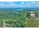 Stunning aerial view of the lakefront property with house, waterfall, and 34 acres of lush landscape at 5200A Burruss Mill Rd, Cumming, GA 30041