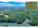 An aerial view featuring the property's 34 acres and four boat docks on Lake Lanier at 5200A Burruss Mill Rd, Cumming, GA 30041
