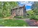 Charming exterior of a two-story home with a well-maintained lawn and mature trees at 5200A Burruss Mill Rd, Cumming, GA 30041