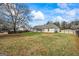 Extensive backyard space showcasing a screened porch, perfect for outdoor gatherings and relaxation at 115 Stewart Hollow Ln, Covington, GA 30016