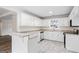 Beautiful eat-in kitchen featuring white cabinets, granite countertops, and modern appliances at 115 Stewart Hollow Ln, Covington, GA 30016