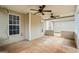 Relaxing screened porch with ceiling fans, offering an airy and comfortable space to enjoy the outdoors at 115 Stewart Hollow Ln, Covington, GA 30016