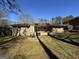 Backyard featuring a nice yard and a patio with chairs at 1988 Bencal Se Dr, Atlanta, GA 30316