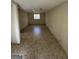 An empty basement with a window and tile floors at 1988 Bencal Se Dr, Atlanta, GA 30316