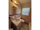 Full bathroom features classic tile, sink, mirror, and toilet at 1988 Bencal Se Dr, Atlanta, GA 30316