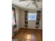 Bright bedroom features hardwood flooring, natural light, and colorful curtains at 1988 Bencal Se Dr, Atlanta, GA 30316