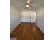 Bright bedroom features hardwood flooring, a ceiling fan, and fresh neutral paint at 1988 Bencal Se Dr, Atlanta, GA 30316